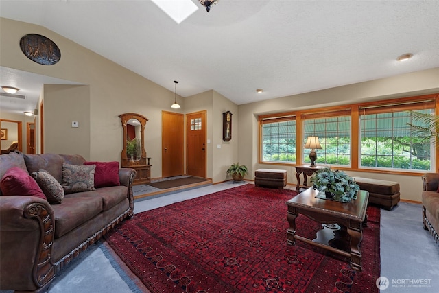 3220 N Pacific Ave, Kelso, WA 98626 - living room featuring carpet floors, lofted ceiling, and baseboards