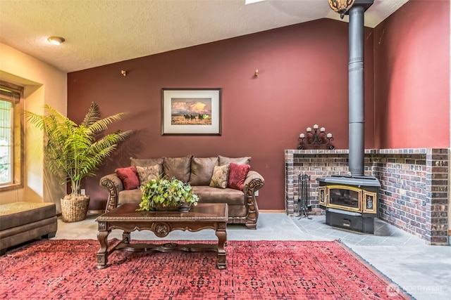 3220 N Pacific Ave, Kelso, WA 98626 - living room with a wood stove, lofted ceiling, and a textured ceiling