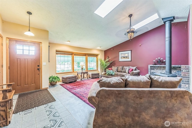 3220 N Pacific Ave, Kelso, WA 98626 - carpeted living area featuring a wood stove, lofted ceiling, and a textured ceiling