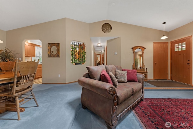 3220 N Pacific Ave, Kelso, WA 98626 - carpeted living room with vaulted ceiling, arched walkways, and baseboards