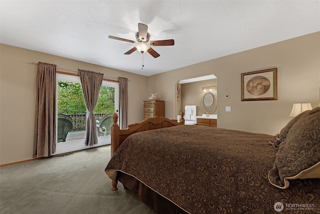 3220 N Pacific Ave, Kelso, WA 98626 - bedroom with carpet flooring, access to exterior, connected bathroom, ceiling fan, and arched walkways
