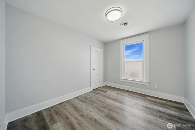 1128 W Elm St, Walla Walla, WA 99362 - spare room with baseboards and wood finished floors