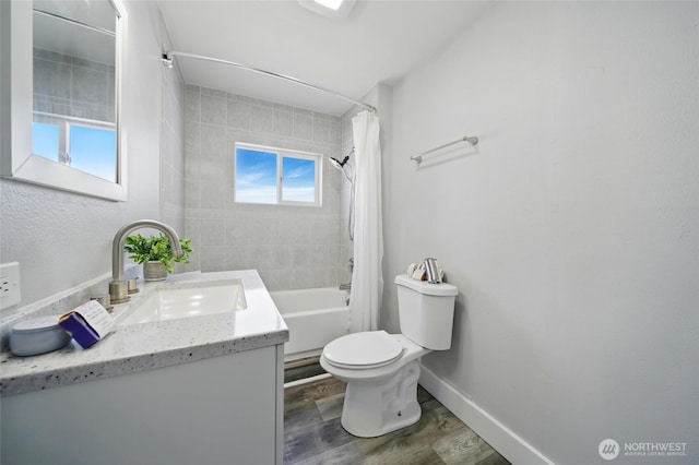 1128 W Elm St, Walla Walla, WA 99362 - full bath with vanity, toilet, wood finished floors, baseboards, and shower / tub combo with curtain