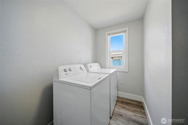 1128 W Elm St, Walla Walla, WA 99362 - laundry room with washing machine and dryer, light wood-style floors, and baseboards
