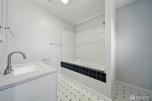 1128 W Elm St, Walla Walla, WA 99362 - full bathroom featuring  shower combination, tile patterned floors, vanity, and baseboards