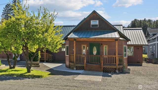706 S A St, Roslyn, WA 98941 - view of front of property featuring covered porch, crawl space, a standing seam roof, and metal roof