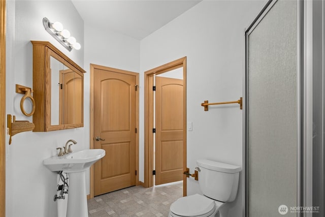 706 S A St, Roslyn, WA 98941 - bathroom with toilet, a shower stall, and a sink