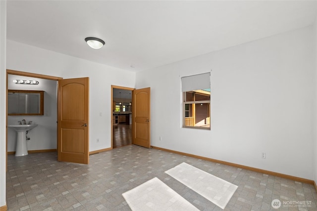 706 S A St, Roslyn, WA 98941 - unfurnished bedroom with baseboards and a sink