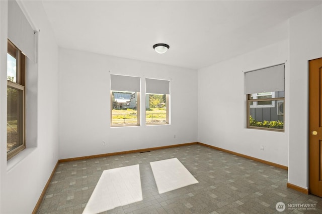706 S A St, Roslyn, WA 98941 - empty room with healthy amount of natural light and baseboards