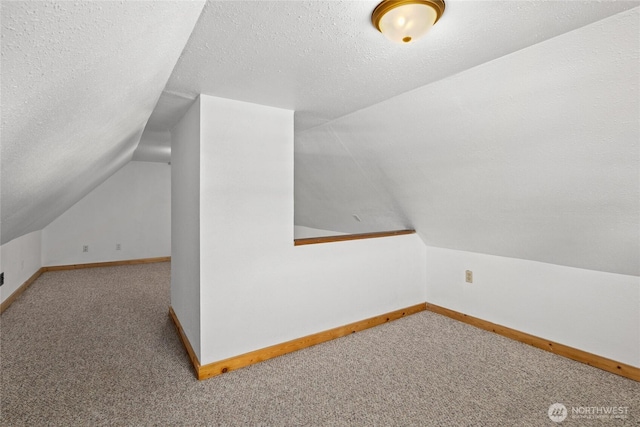 706 S A St, Roslyn, WA 98941 - bonus room featuring lofted ceiling, carpet floors, baseboards, and a textured ceiling