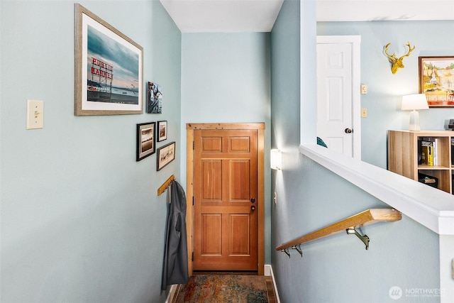 490 Madison Ave N Unit 202, Bainbridge Island, WA 98110 - doorway to outside featuring dark stone finish flooring