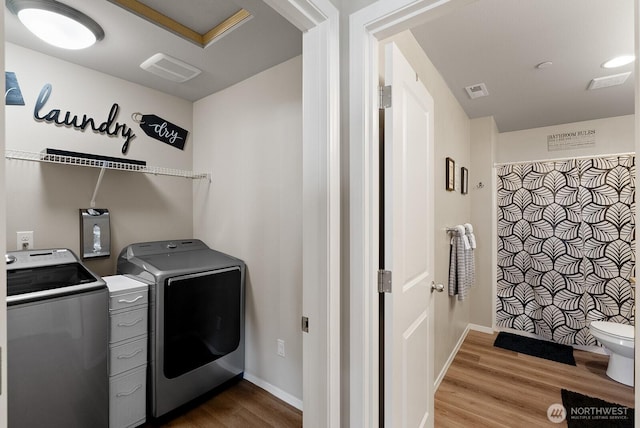 2225 Seringa Ave, Bremerton, WA 98310 - washroom featuring washing machine and clothes dryer, wood finished floors, and baseboards