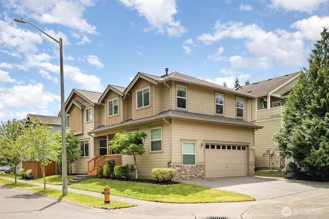 1700 235th Pl SW, Bothell, WA 98021 - townhome / multi-family property with a garage, driveway, stone siding, and a front lawn