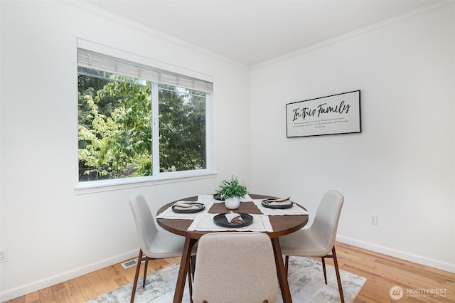 1700 235th Pl SW, Bothell, WA 98021 - dining room with crown molding, baseboards, and hardwood / wood-style flooring