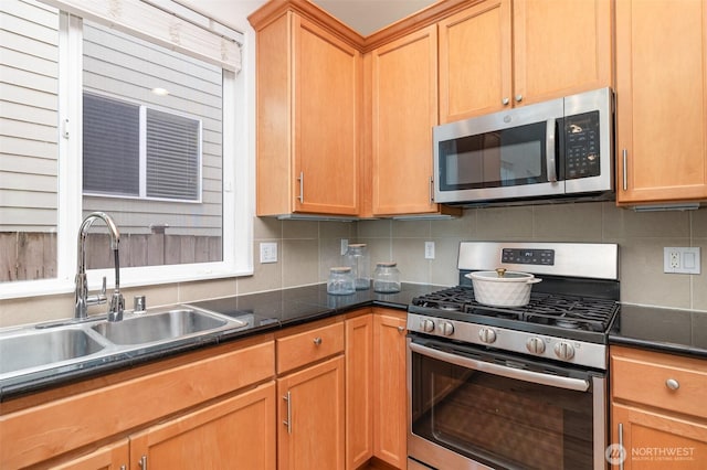 1700 235th Pl SW, Bothell, WA 98021 - kitchen with stainless steel appliances, a sink, dark countertops, and tasteful backsplash