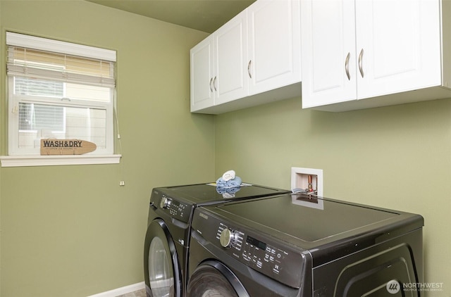 1700 235th Pl SW, Bothell, WA 98021 - laundry room featuring cabinet space, washing machine and clothes dryer, and baseboards