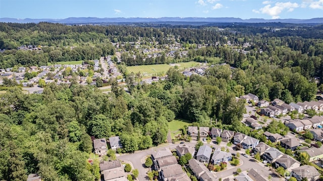 1700 235th Pl SW, Bothell, WA 98021 - aerial view of property and surrounding area with a heavily wooded area, nearby suburban area, and mountains