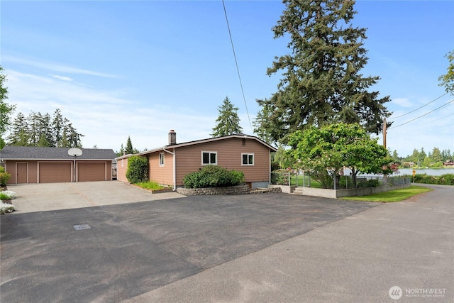 16801 Lakeside Dr S, Spanaway, WA 98387 - ranch-style home with an outbuilding, a chimney, and a detached garage