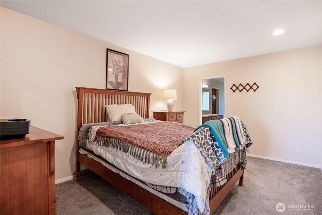 927 Pheasant Run, Westport, WA 98595 - bedroom featuring light colored carpet, baseboards, recessed lighting, and connected bathroom