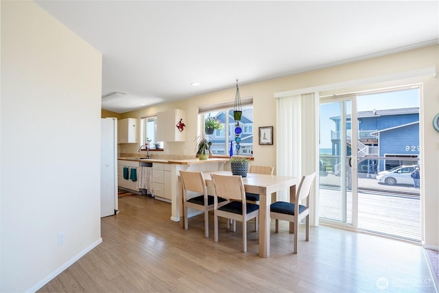927 Pheasant Run, Westport, WA 98595 - dining room featuring light wood-style flooring and baseboards