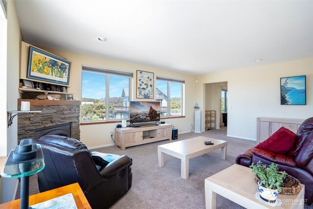 927 Pheasant Run, Westport, WA 98595 - living area with baseboards, carpet floors, and a fireplace