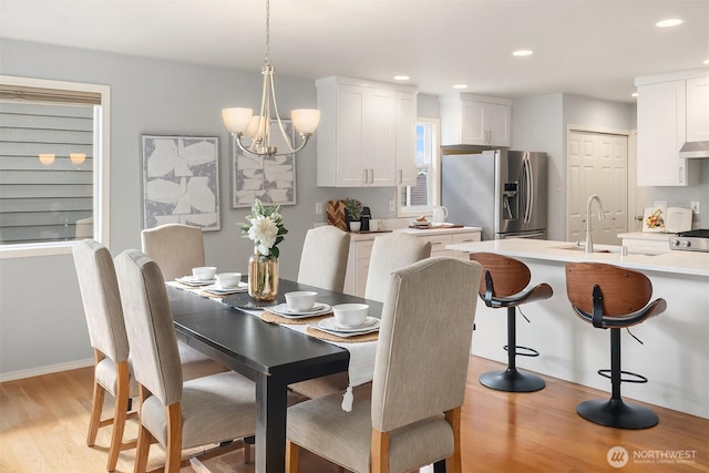 14819 1st Ave NE, Duvall, WA 98019 - dining space featuring light wood finished floors, a chandelier, and recessed lighting