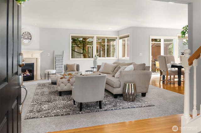 14819 1st Ave NE, Duvall, WA 98019 - living room featuring a tiled fireplace and wood finished floors