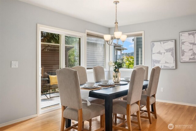 14819 1st Ave NE, Duvall, WA 98019 - dining space featuring a chandelier, light wood-type flooring, and baseboards