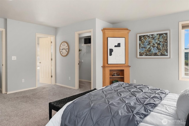14819 1st Ave NE, Duvall, WA 98019 - carpeted bedroom featuring a spacious closet, baseboards, connected bathroom, and a closet