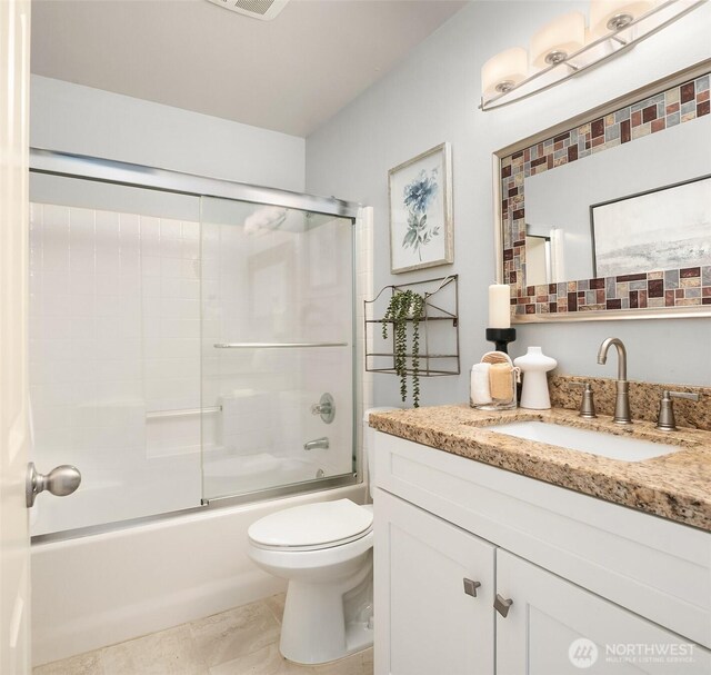 14819 1st Ave NE, Duvall, WA 98019 - bathroom with vanity, toilet, enclosed tub / shower combo, and tile patterned floors