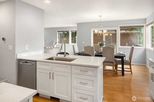 14819 1st Ave NE, Duvall, WA 98019 - kitchen with a sink, stainless steel dishwasher, light countertops, white cabinets, and recessed lighting