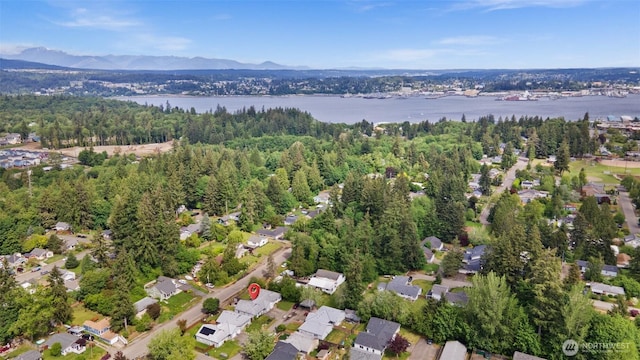 515 Forest Park St, Port Orchard, WA 98366 - aerial view of property and surrounding area featuring a water and mountain view, nearby suburban area, and a heavily wooded area