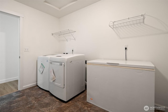 6623 NW Northridge Ln, Bremerton, WA 98312 - laundry area featuring washer and clothes dryer, baseboards, and stone finish flooring