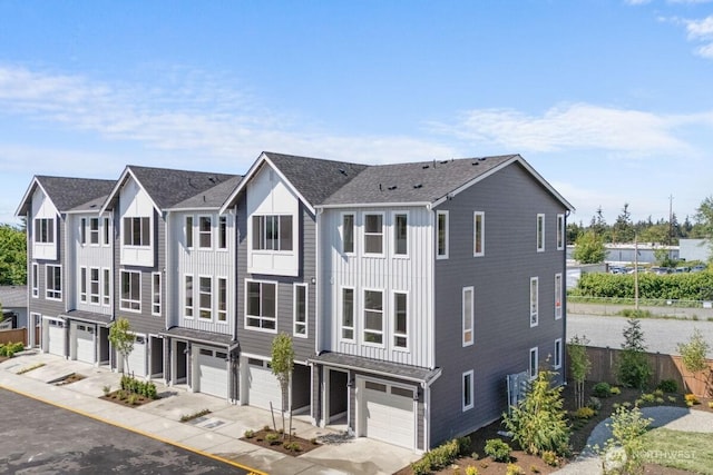 15726 40th Ave W Unit B3, Lynnwood, WA 98087 - view of front of home featuring an attached garage, driveway, board and batten siding, and a shingled roof