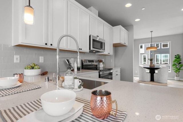 15726 40th Ave W Unit B3, Lynnwood, WA 98087 - kitchen featuring appliances with stainless steel finishes, white cabinetry, decorative backsplash, and recessed lighting