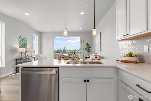 15726 40th Ave W Unit B6, Lynnwood, WA 98087 - kitchen featuring dishwasher, a sink, white cabinets, healthy amount of natural light, and recessed lighting