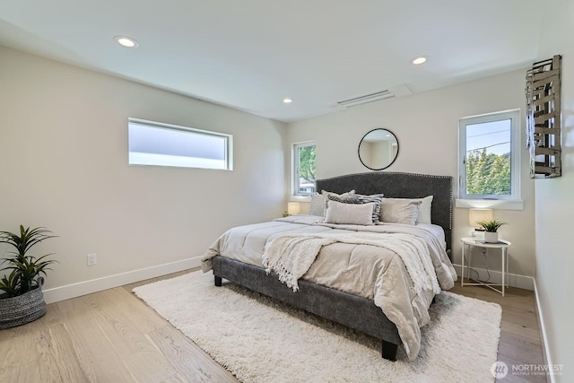 524 27th Ave, Seattle, WA 98122 - bedroom with baseboards, wood finished floors, recessed lighting, and a wall unit AC