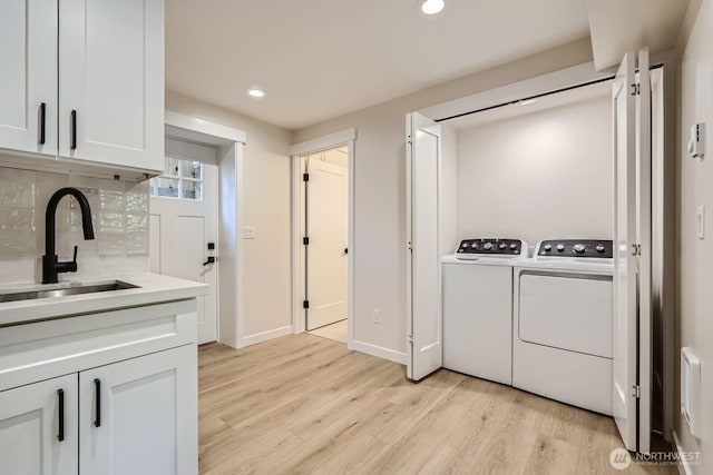 524 27th Ave, Seattle, WA 98122 - laundry room featuring independent washer and dryer, recessed lighting, light wood finished floors, and baseboards