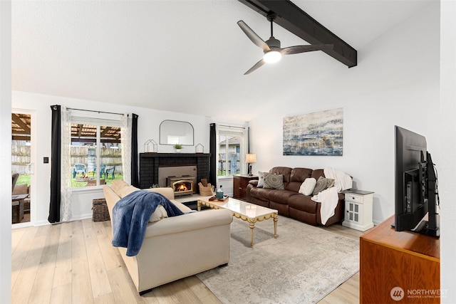 5371 Pineridge Dr NE, Bremerton, WA 98311 - living room featuring light wood-style flooring, a ceiling fan, and a fireplace