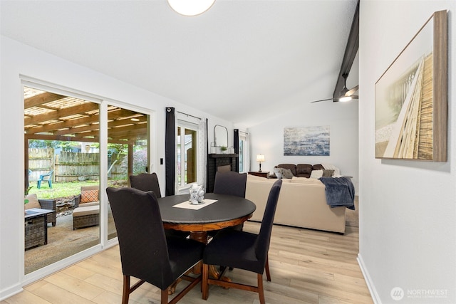 5371 Pineridge Dr NE, Bremerton, WA 98311 - dining space featuring vaulted ceiling, light wood finished floors, and baseboards