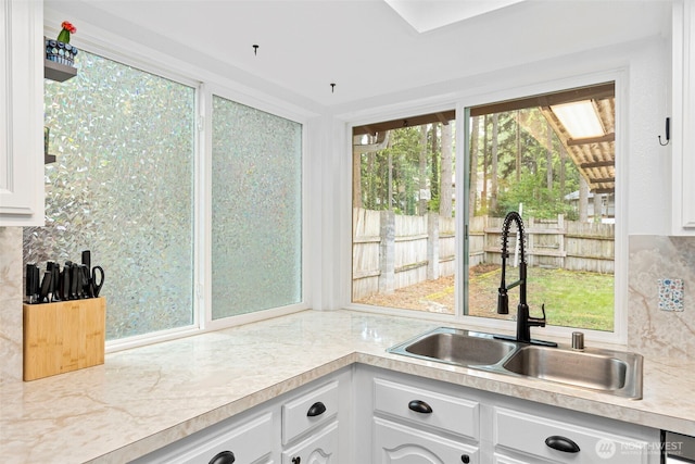 5371 Pineridge Dr NE, Bremerton, WA 98311 - kitchen featuring a sink, light countertops, and white cabinetry