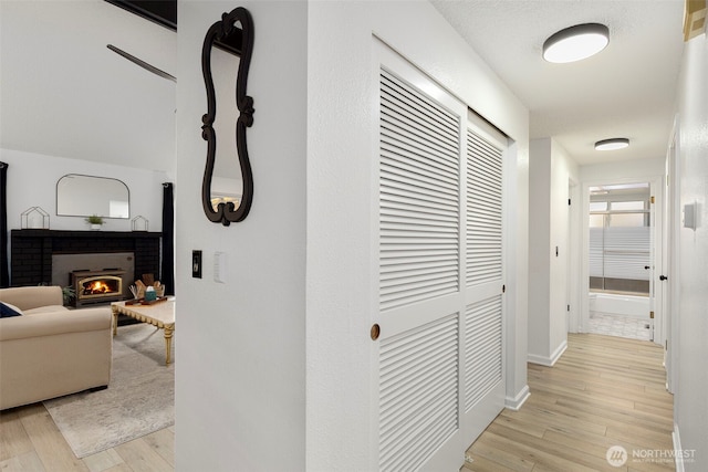 5371 Pineridge Dr NE, Bremerton, WA 98311 - hallway featuring light wood-style floors and baseboards