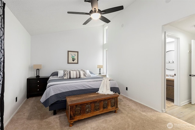 5371 Pineridge Dr NE, Bremerton, WA 98311 - bedroom featuring vaulted ceiling, light carpet, baseboards, ceiling fan, and ensuite bathroom