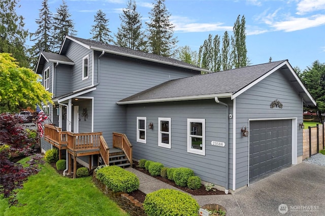 23588 Cooma Pl, Mount Vernon, WA 98274 - view of home's exterior with a deck, roof with shingles, and concrete driveway