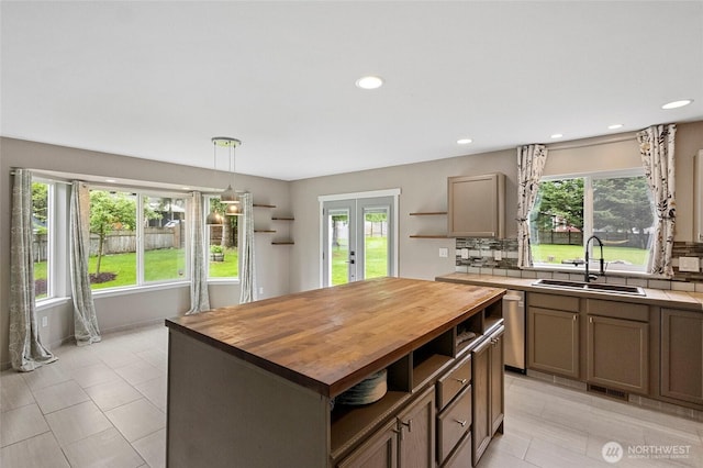 23588 Cooma Pl, Mount Vernon, WA 98274 - kitchen with open shelves, wooden counters, a sink, light tile patterned flooring, and recessed lighting