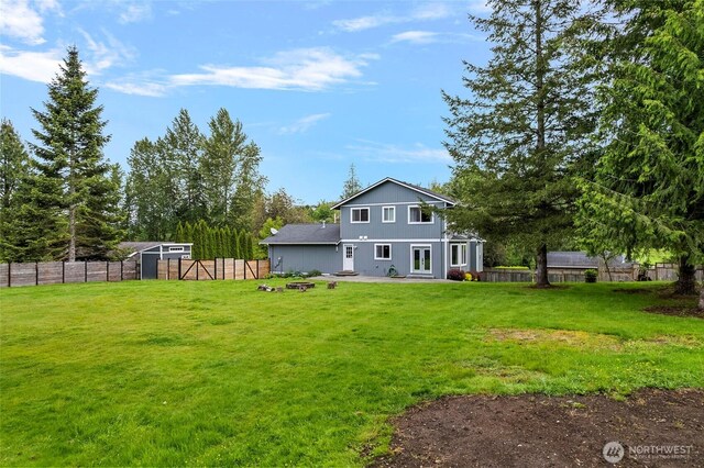 23588 Cooma Pl, Mount Vernon, WA 98274 - rear view of house featuring a patio area and an outdoor fire pit
