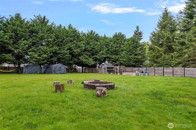 23588 Cooma Pl, Mount Vernon, WA 98274 - view of yard featuring an outdoor fire pit