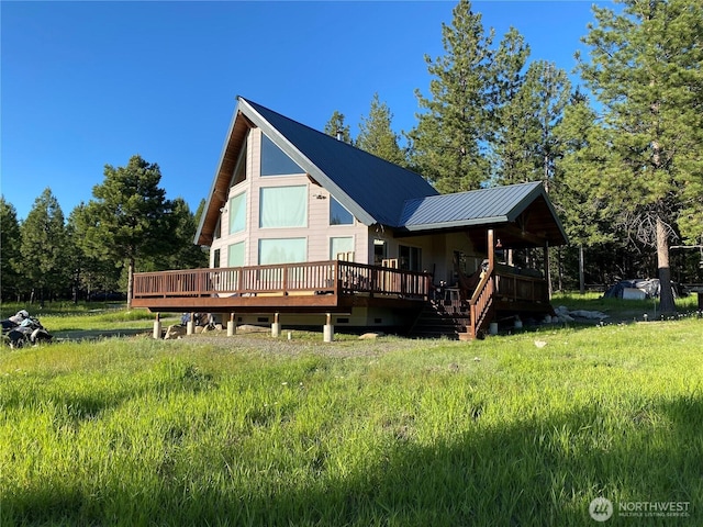 302 Summer Rd, Tonasket, WA 98855 - back of property featuring a deck and metal roof