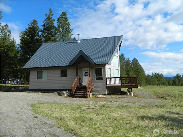 302 Summer Rd, Tonasket, WA 98855 - view of front facade featuring metal roof and a deck