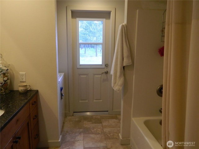 302 Summer Rd, Tonasket, WA 98855 - full bathroom with vanity, baseboards, and shower / washtub combination